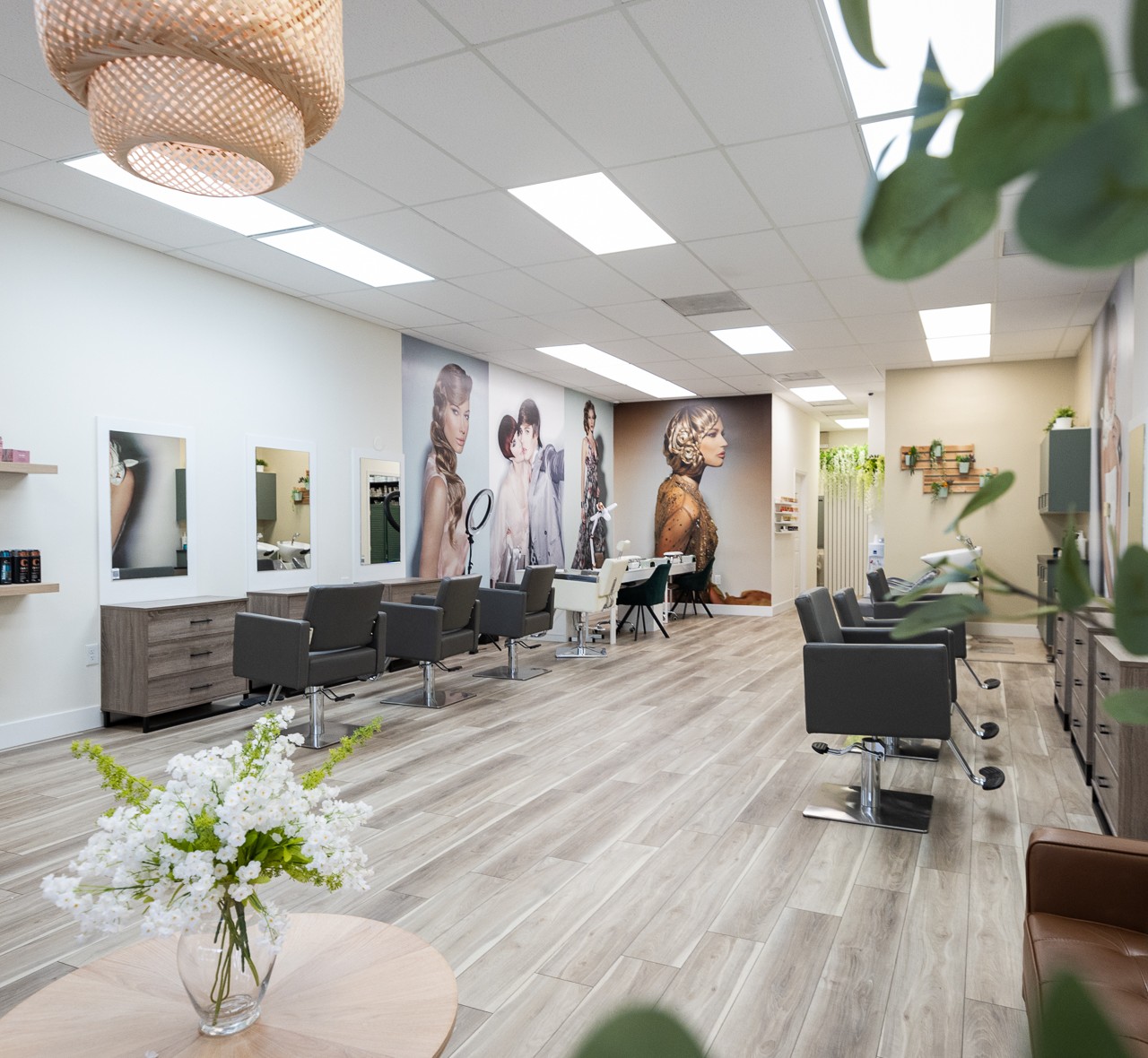 Inside Babelle Salon & Spa — styling stations, mirrors and editorial wall murals