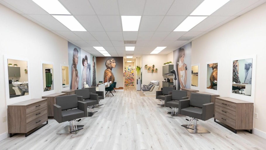 Wash stations, styling chairs and editorial wall murals at Babelle Salon & Spa